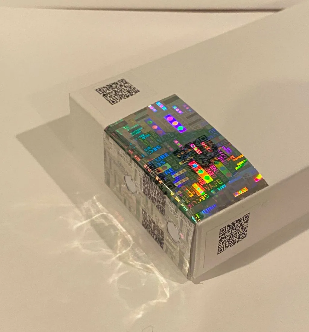 Holographic tamper label on a carton